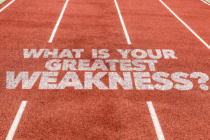 Running track with the question "What is your greatest weakness?" painted on in white