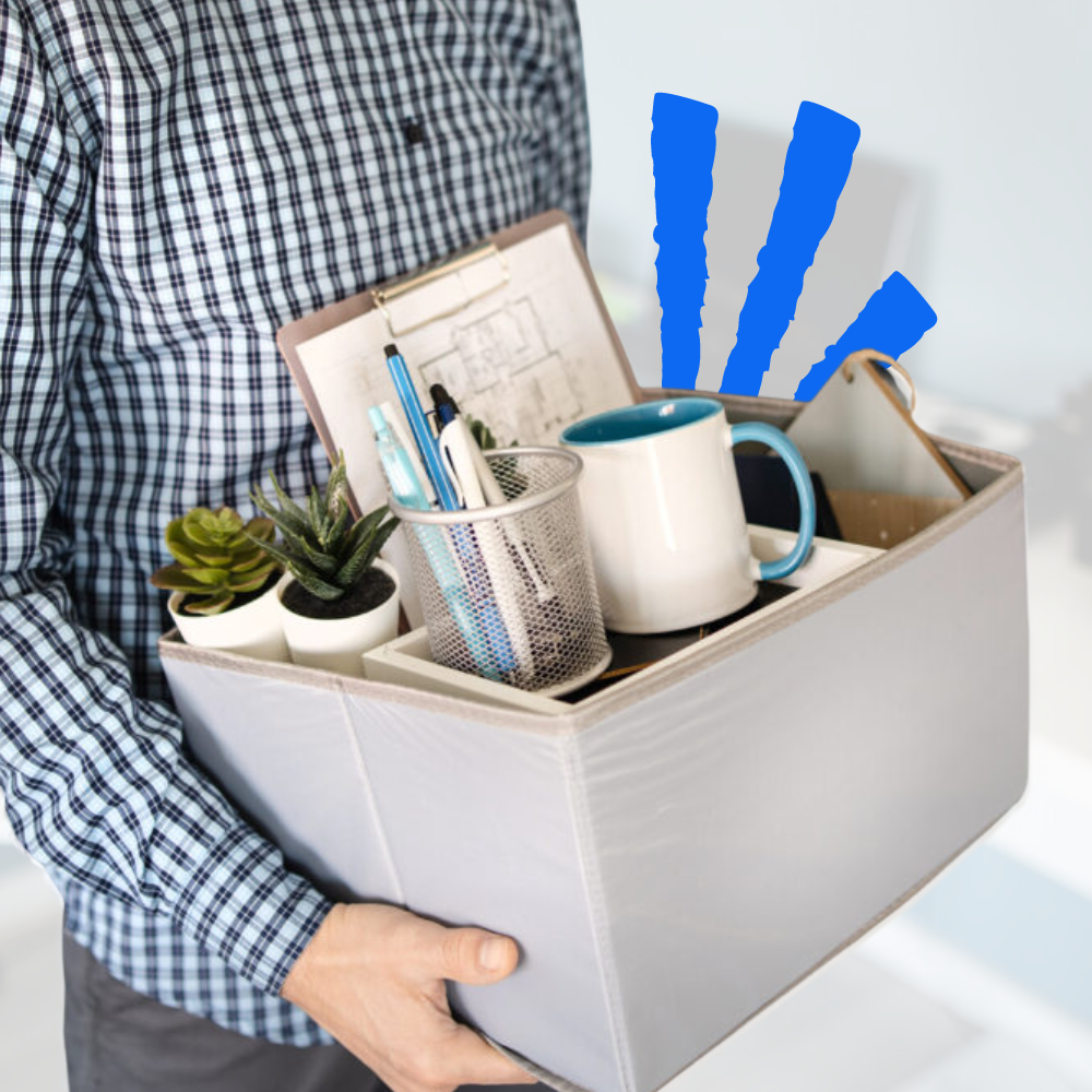 Professional who just got laid off holding a box of their things