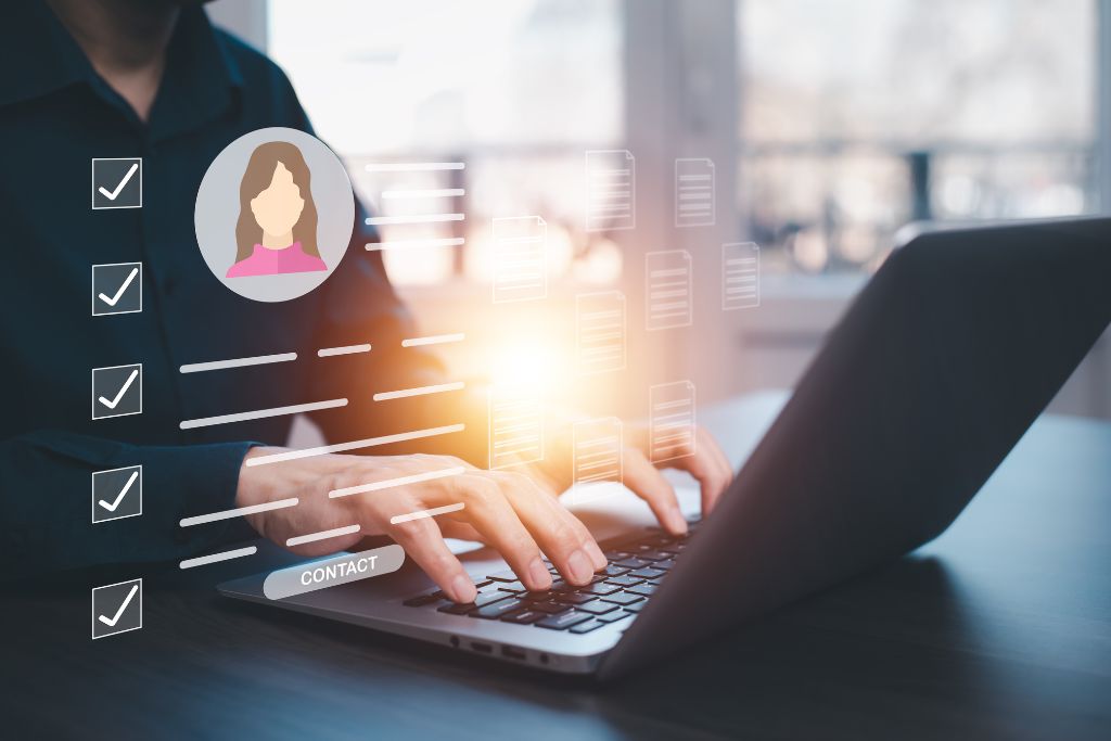 Person typing on a laptop with a digital overlay of a checklist and a female avatar profile, representing the process of evaluating and selecting a candidate for a job.